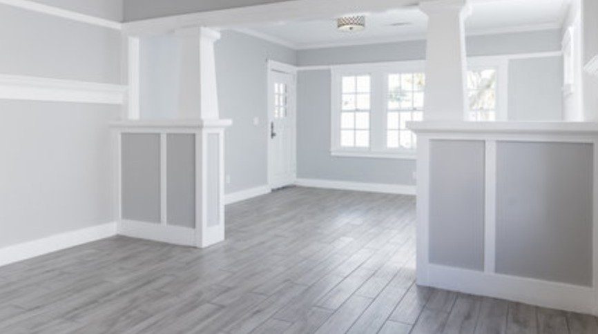 Open craftsman-style interior painted in soft gray and white